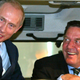German chancellor Gerhard Schröder (right) and Russian president Vladimir Putin sit in a tractor at trade fair in Hanover in April 2005.